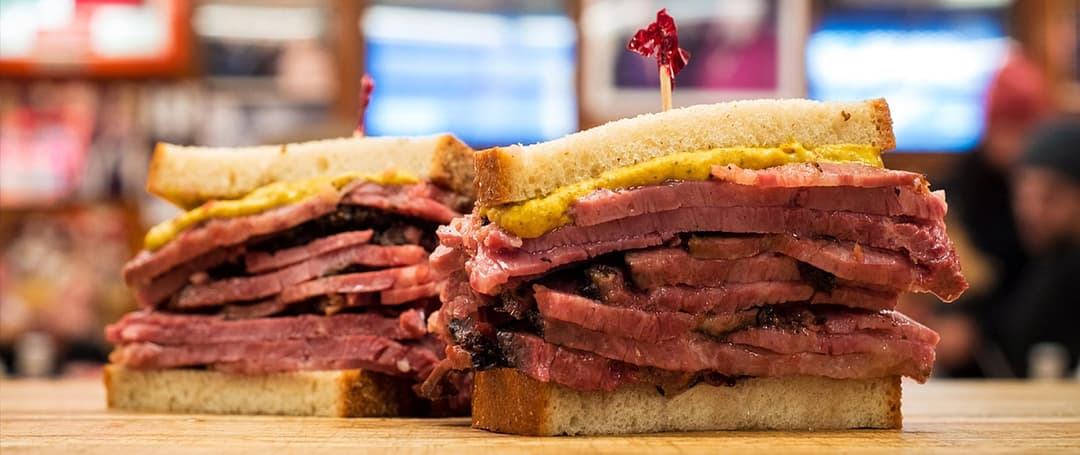 Pastrami sandwich cut into two pieces